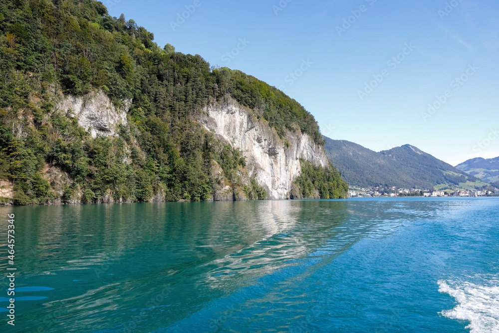 Swiss landscape on a lake with mountains