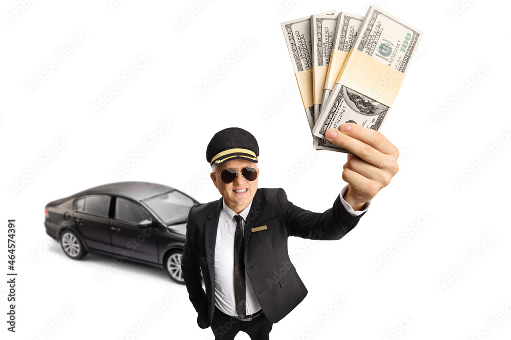 Chauffeur with a black car holding stacks of money Chauffeur with a black car holding stacks of money