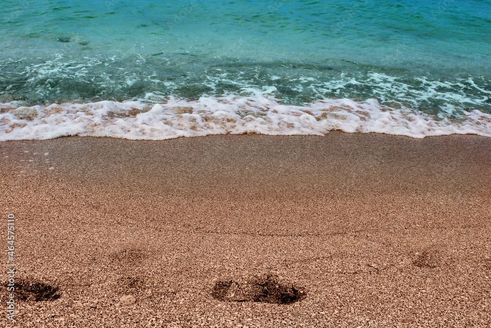 Blue sea wave on a pebble beach. Blue sea wave on a pebble beach.