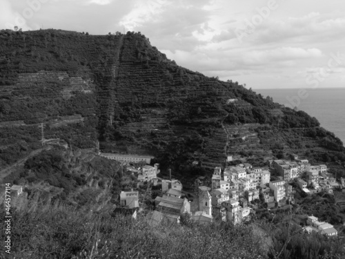 Liguria, Italy - October 10, 2021: Beautiful photography in black and white to the ligurian places with panoramic view to the old buildings and clear sky in the background.