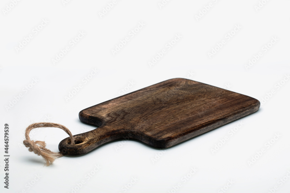 Fototapeta premium Brown wooden cutting board on white background