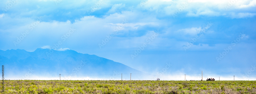 Pano image of Dust storm brewing in the Colorado plains with the San Juan Mountains in the background