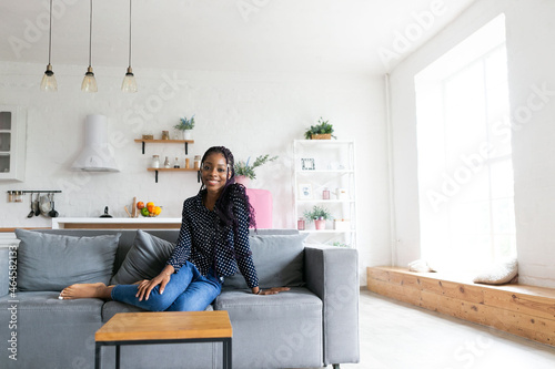 Portrait young black woman smiling happy braids