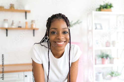 Portrait young black woman smiling happy braids
