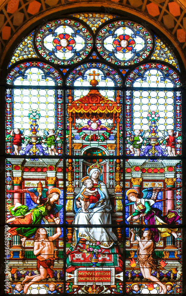 Madonna with child and angels. Cathedral stained glass window - Church in Rome