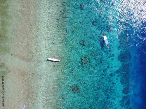 water drops on the window drone view island boat nature explore summer adventure lifestyle Bali Indonesia island Gili T corals blues shades