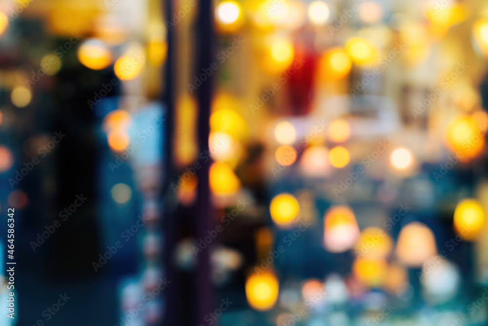 Defocused blurred view of store showcase selling multiple types of house luminaires lamps Defocused blurred view of store showcase selling multiple types of house luminaires lamps