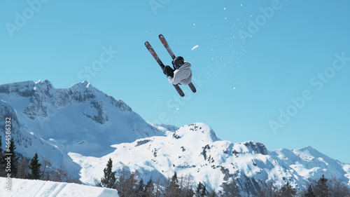 Bilde på lerret Male tourist freestyle skiing in the Slovenian mountains does a flip trick