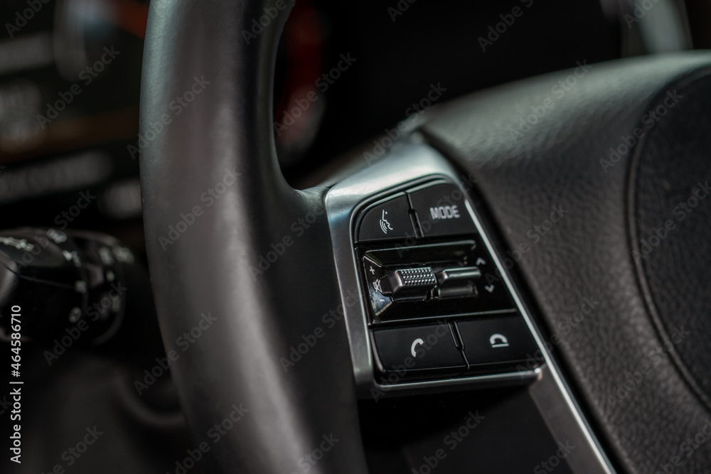 Multiple buttons on the steering wheel to accept or reject calls from the phone close up view. Answer and reject phone buttons. Multiple buttons on the steering wheel to accept or reject calls from the phone close up view. Answer and reject phone buttons.