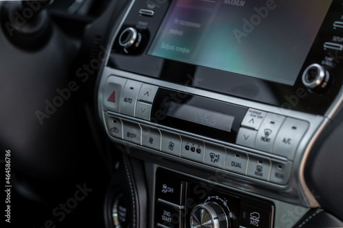 Modern car media display in the interior of the car. Touchscreen monitor on the dashboard of the modern car.. © Roman