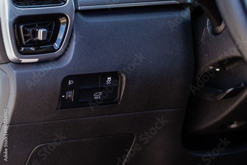 Close up view of modern car electronic safety systems control panel. Modern car interior detail.