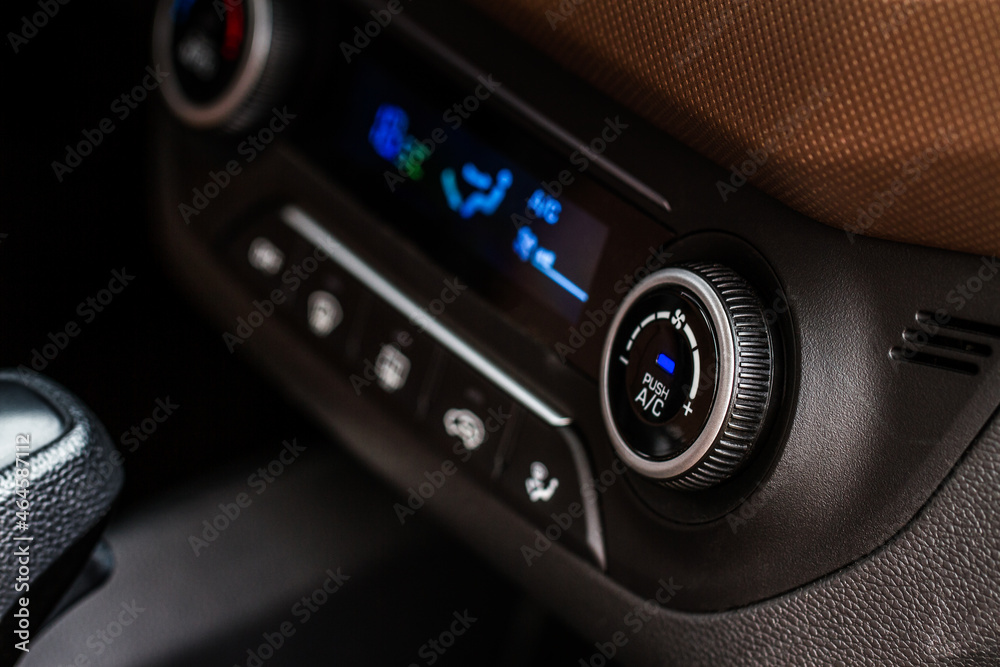 Fototapeta premium Digital control panel car air conditioner dashboard. Modern car interior conditioning buttons inside a car close up view.