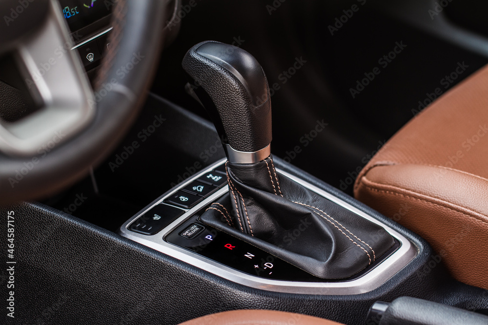 Modern automatic gearbox. Close up of the gearbox transmission handle. Automatic gear stick. Modern automatic gearbox. Close up of the gearbox transmission handle. Automatic gear stick.