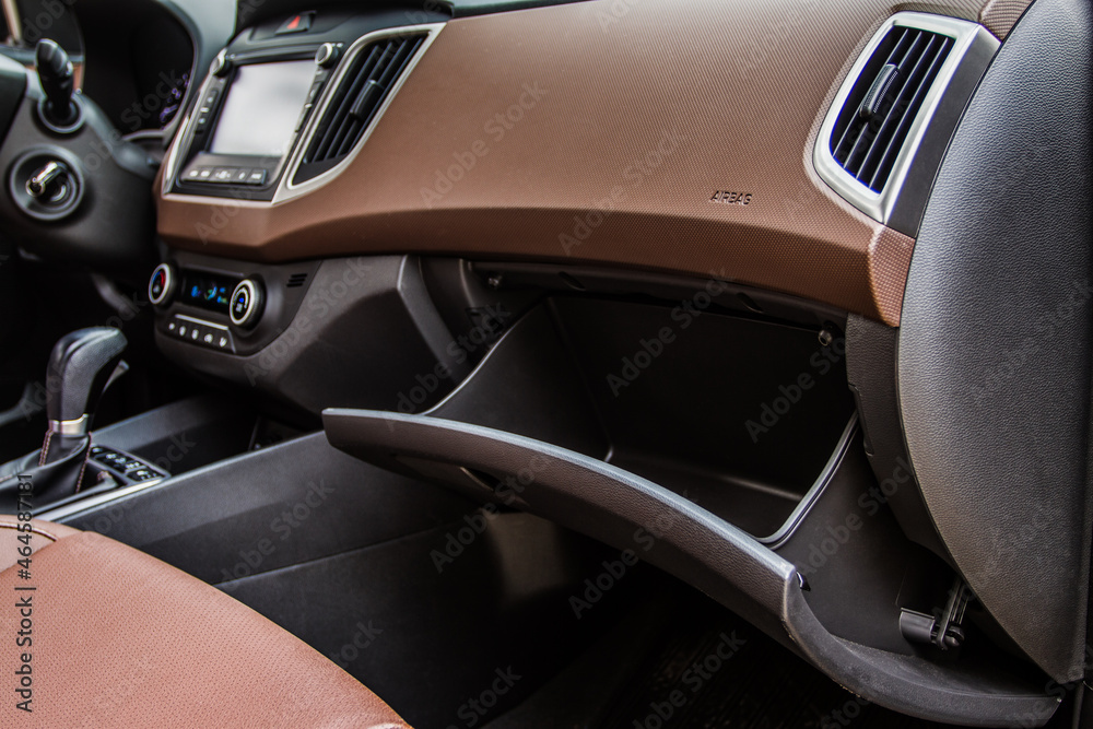 Opened car glove box compartment. Glove compartment of car. foto de Stock Adobe Stock
