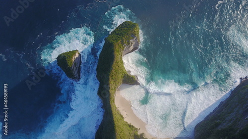 exotic tropical mountain waves sea ocean nature island stone paradise natural water blue vegetation forest trees visual drone beach sand lines Indonesia Nusa Penida photo