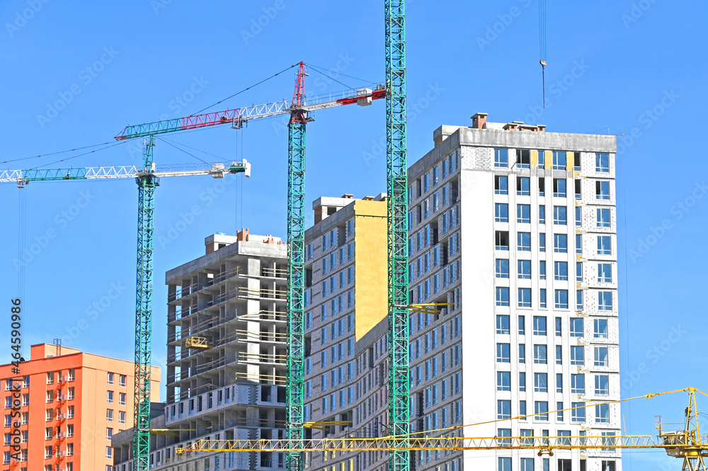 Crane and highrise construction site Crane and highrise construction site