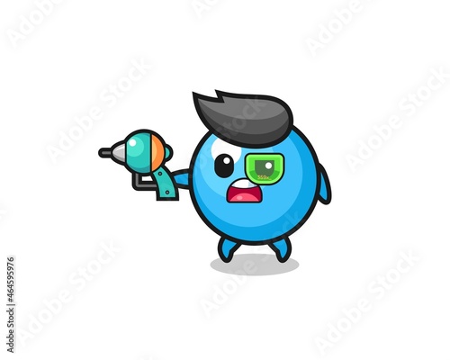 cute gum ball holding a future gun © heriyusuf