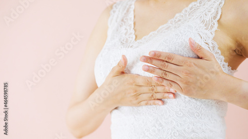 胸を揉む女性（美容・ダイエット・バストアップ・乳がんセルフチェック） photo