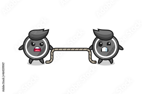 cute hockey puck character is playing tug of war game