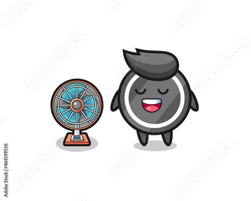 cute hockey puck is standing in front of the fan