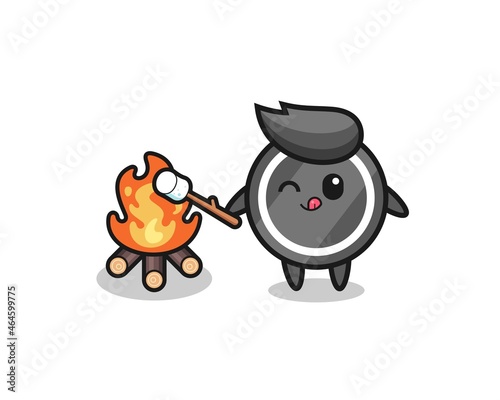 hockey puck character is burning marshmallow