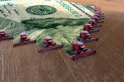 Mass soybean harvesting at a farm in Mato Grosso state,Brazil. Concept commodities with agribusiness, and dollar banknote.