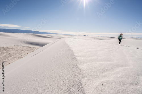 Hiker On The Edge of Sand Dune On Bright Day