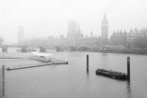 Black and white image of fog descending on the River Thames with Parliament
