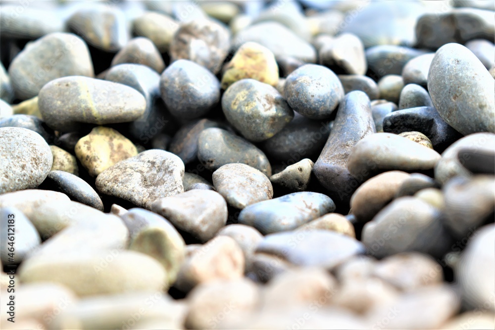 Abstract texture and background gray pebbles at the coastline close-up. High quality photo Abstract texture and background gray pebbles at the coastline close-up. High quality photo