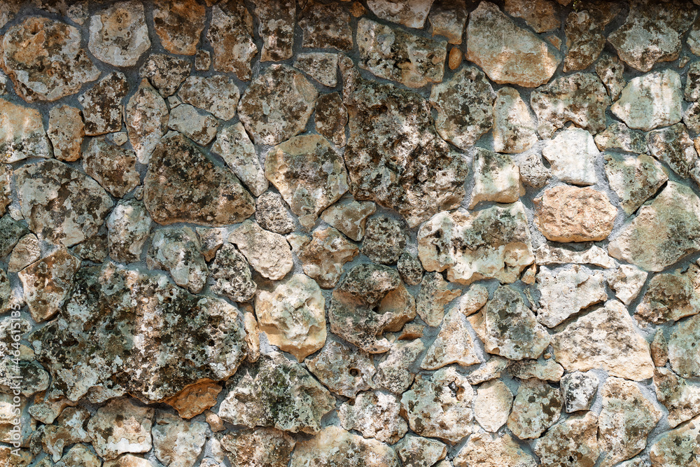 background fragment of a stone wall close-up