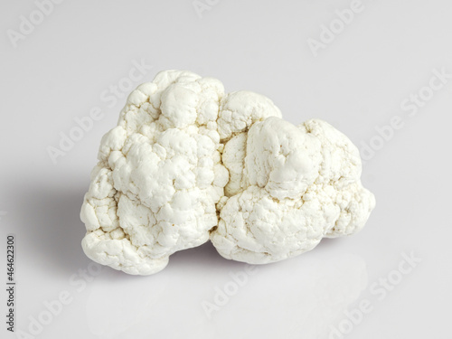 Magnesite on a white background. It is used in industry, lithotherapy, jewelry.
