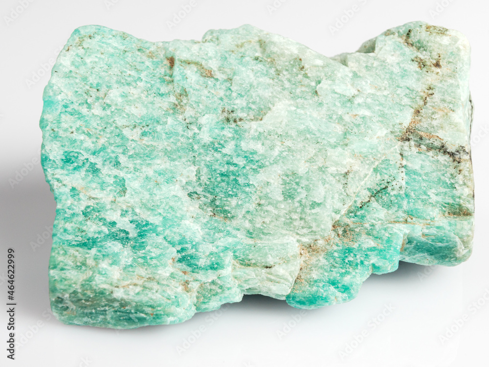 Amazonite on a white background. Exotic ornamental stone. Amazonite on a white background. Exotic ornamental stone.