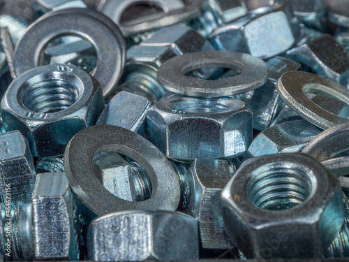 A group of bolts, nuts and washers close up. Fasteners. © Андрей Попов