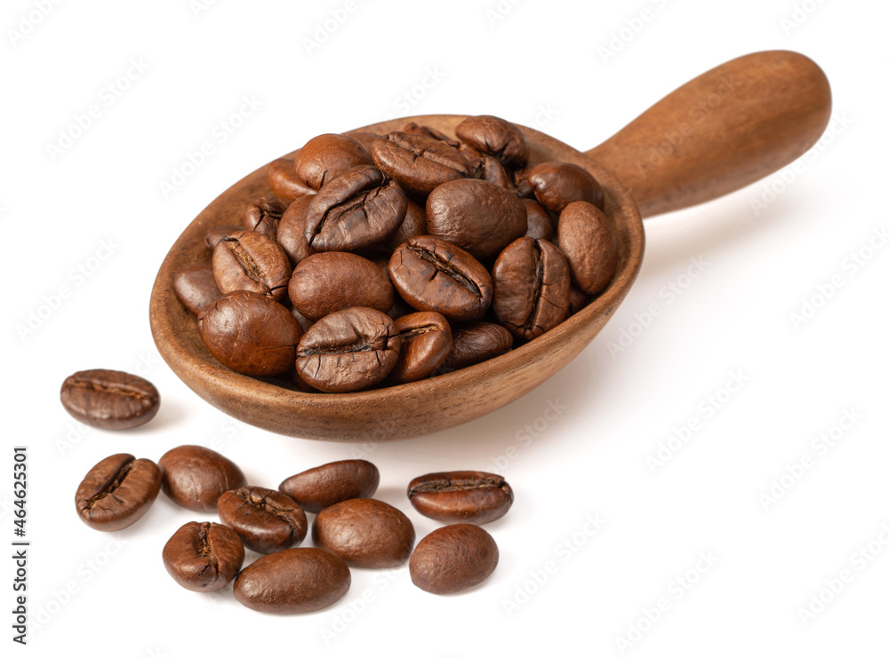 Fototapeta premium Coffee beans in the wooden spoon, isolated on white background.