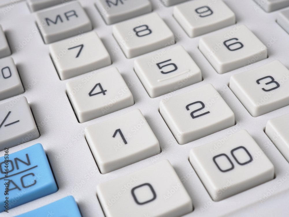 Gray calculator keyboard buttons close up. Light background or wallpaper. Economy, finance, money, commerce. Bank, credit, loan, deposit, interest. Business project and decision making. Macro Gray calculator keyboard buttons close up. Light background or wallpaper. Economy, finance, money, commerce. Bank, credit, loan, deposit, interest. Business project and decision making. Macro