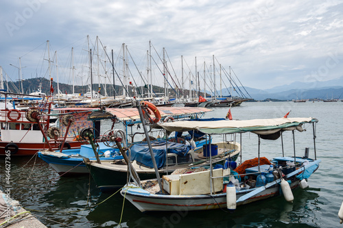 Yachts and boats in the harbor  Fethie  Turkey. The promenade of the city of Fethiye  boats are at bay in the blue waters of the Mediterranean. The resort town of Turkey.