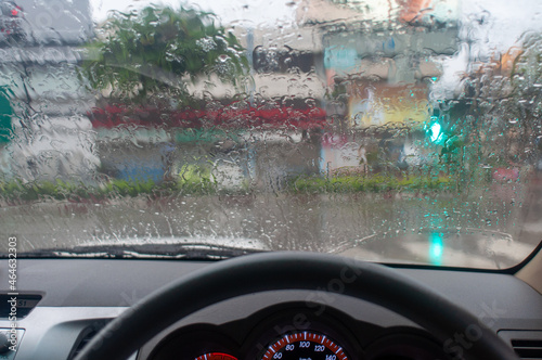 Rainy day background with copy space. Drops of water on car glass.Entering the rainy season.