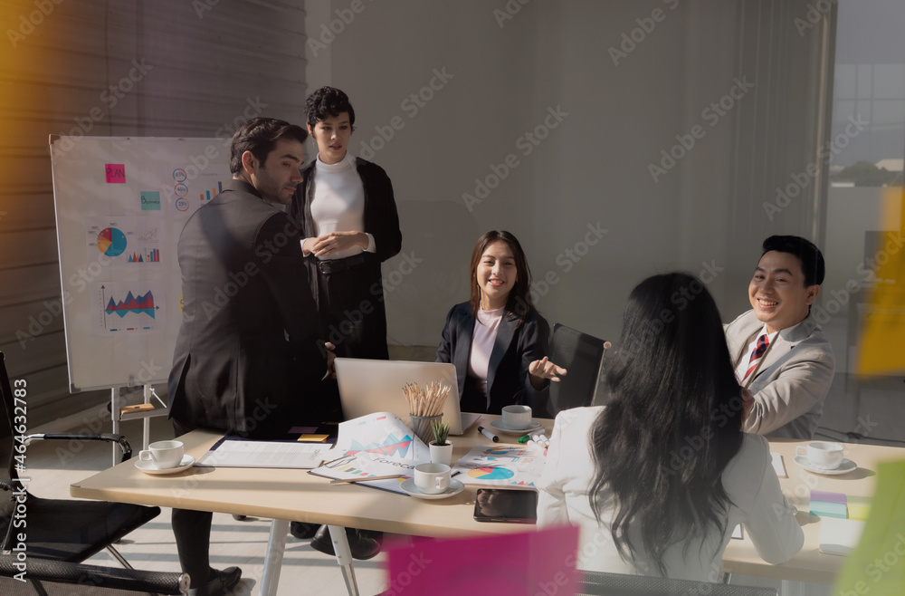 Group young business people, Are meeting with concentration. In conference room where documents, computers present the work of team. To work successfully, planning and strategy meetings are required. Group young business people, Are meeting with concentration. In conference room where documents, computers present the work of team. To work successfully, planning and strategy meetings are required.