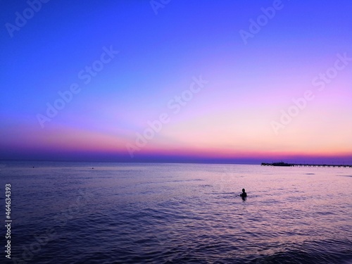 
very bright color of the sunset sky on the sea beach, turquoise, fiery red