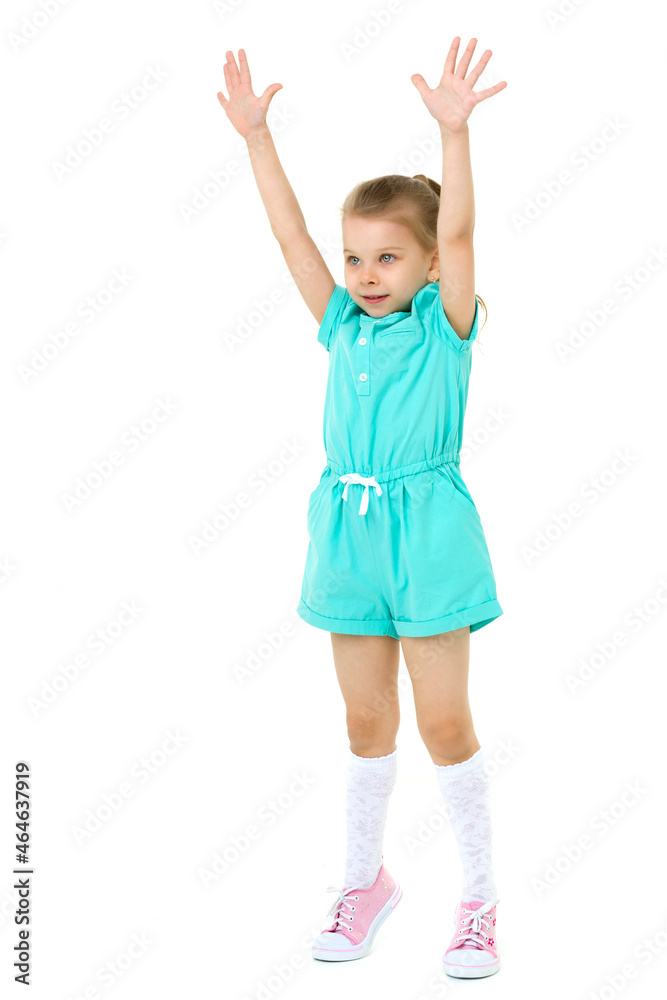 Little girl standing on tiptoes with her hands up Little girl standing on tiptoes with her hands up