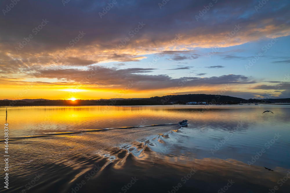 Sunrise aerial waterscape over the bay with cloud cover