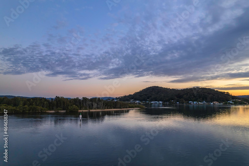 Sunrise aerial waterscape over the bay with cloud cover