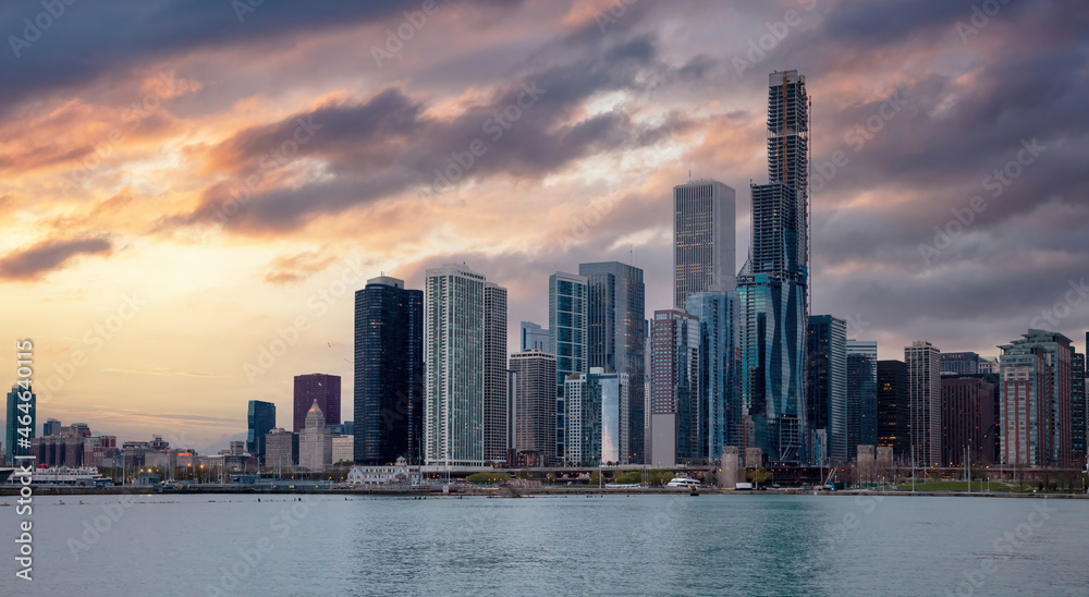 Chicago Illinois skyline, sunset time, waterfront skyscrapers blue cloudy sky background, USA