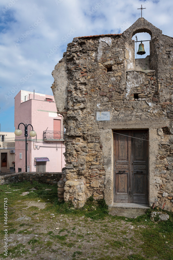 Miglionico, Matera. View of  remain of abandoned church next new houses.