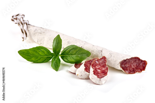 Traditional Spanish Fuet thin dried sausage with slices, Close-up, isolated on a white background.