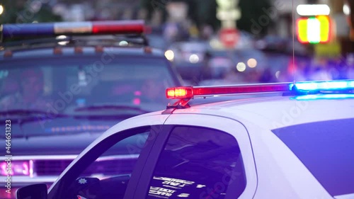Flashing lights on a police car in a big city