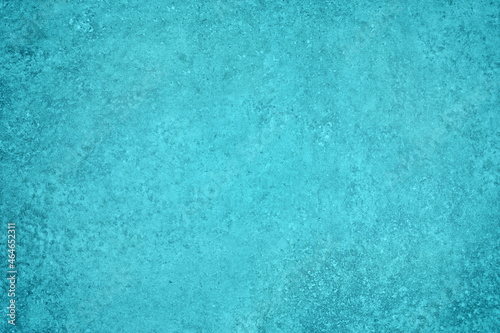 Turquoise blue plaster texture. Textured wall cyan color backdrop. Rough pastel teal painted abstract background