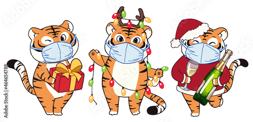 Cute little tigers wearing Christmas costume and medical mask.