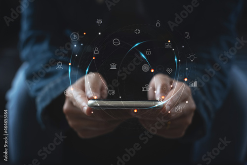 IoT, Internet of Things, online shopping, digital marketing, E-commerce, business and technology concept. Woman using mobile phone and laptop computer fro online shopping and banking