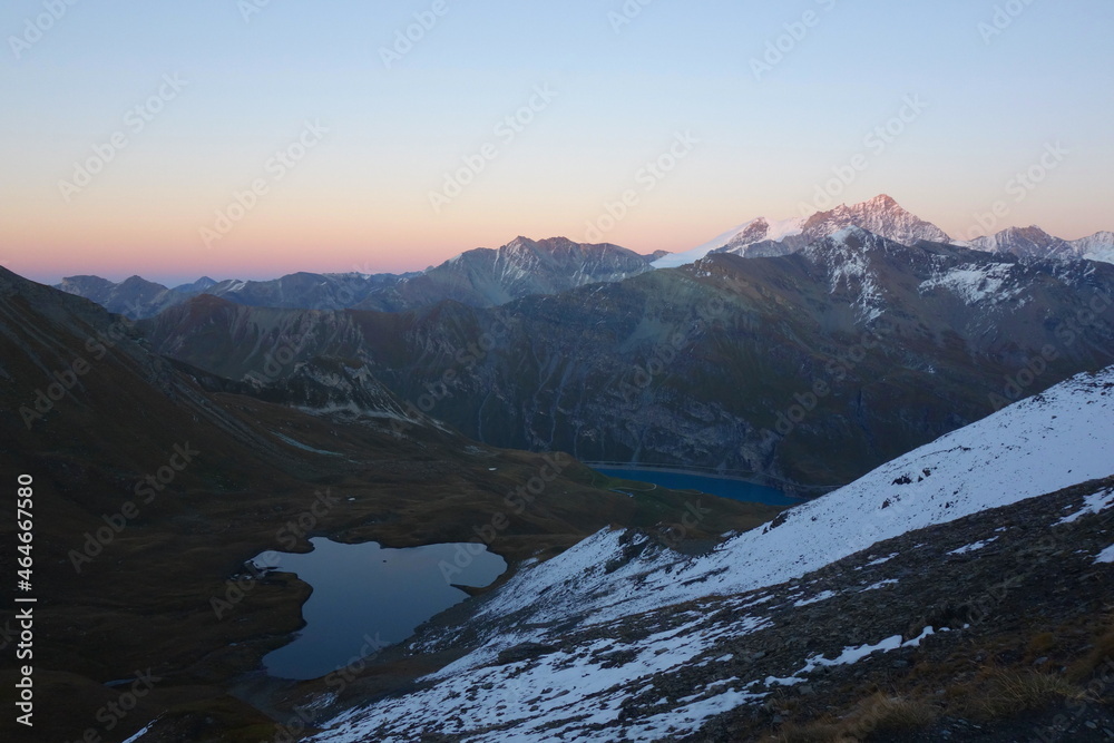 Sunset at Lac de Moiry mountain lake in the area of Griments in Valais Canton, Switzerland